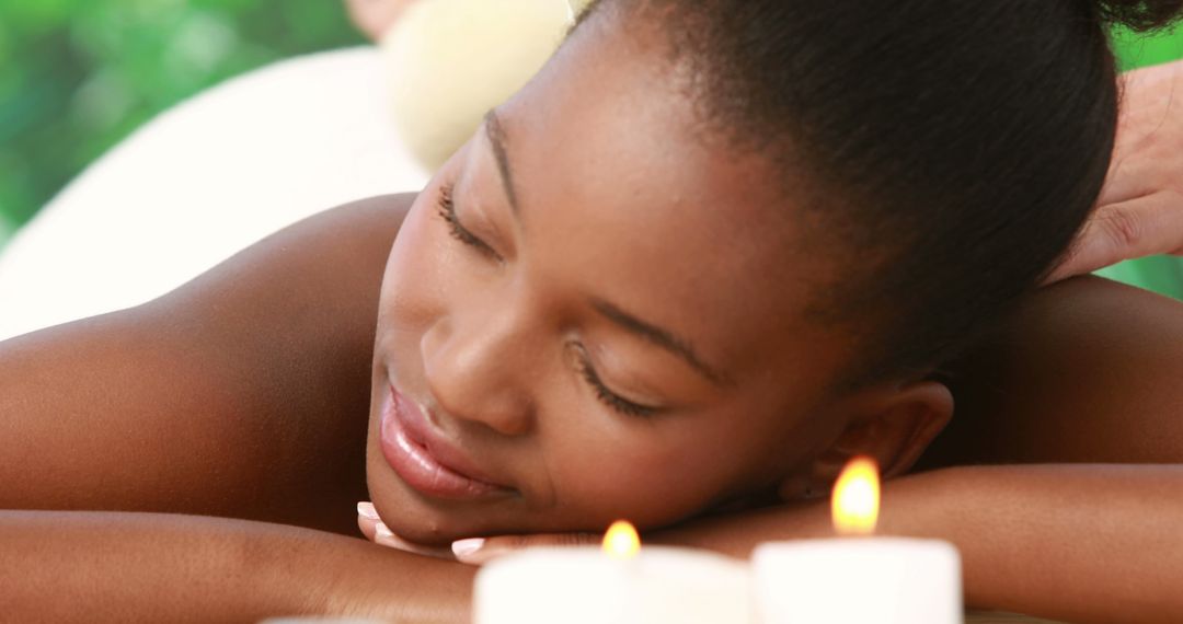 Young Woman Relaxing During Spa Treatment with Aromatherapy Candles - Free Images, Stock Photos and Pictures on Pikwizard.com