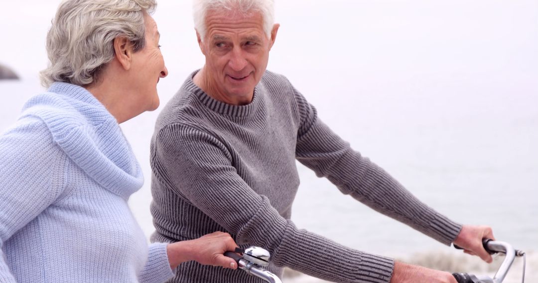 Senior Couple Enjoying Biking Together on the Beach - Free Images, Stock Photos and Pictures on Pikwizard.com