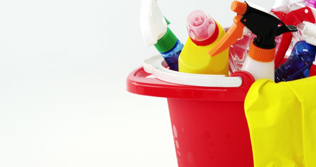 Close-up of Cleaning Supplies in Red Bucket on White Background - Free Images, Stock Photos and Pictures on Pikwizard.com