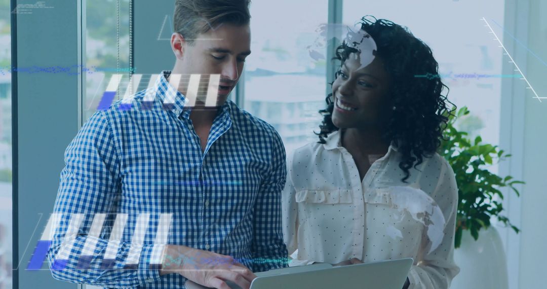 Diverse Professionals Collaborating on Laptop in Bright Office