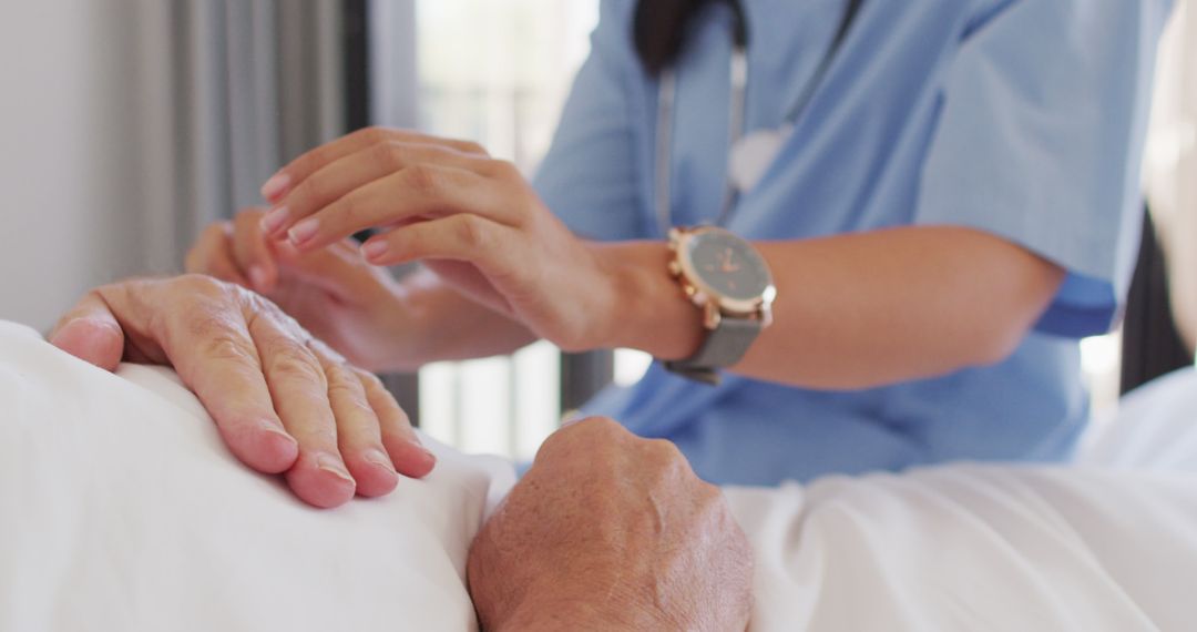 Nurse Providing Care to Elderly Patient in Hospital - Free Images, Stock Photos and Pictures on Pikwizard.com