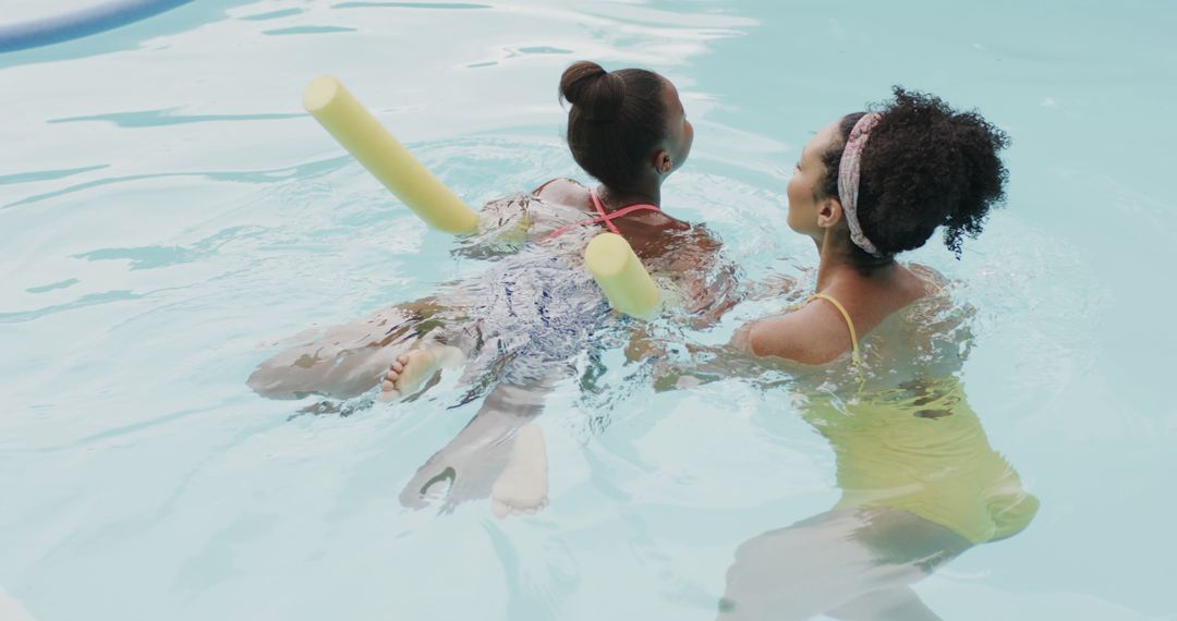 Children Learning to Swim with Float Noodles in Pool - Free Images, Stock Photos and Pictures on Pikwizard.com