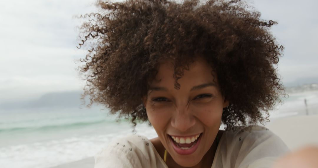 Excited Woman Taking Selfie on Beach - Free Images, Stock Photos and Pictures on Pikwizard.com