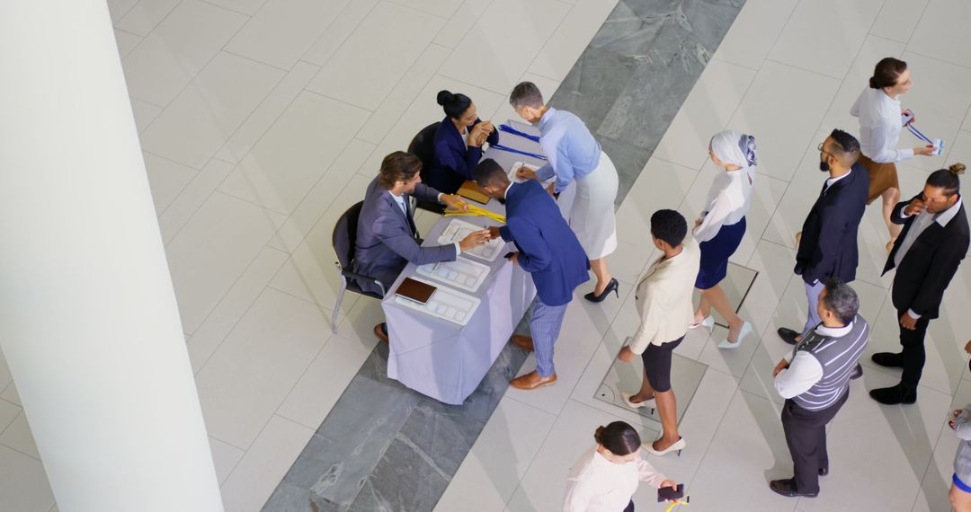 Professionals Registering at Conference Check-in Table