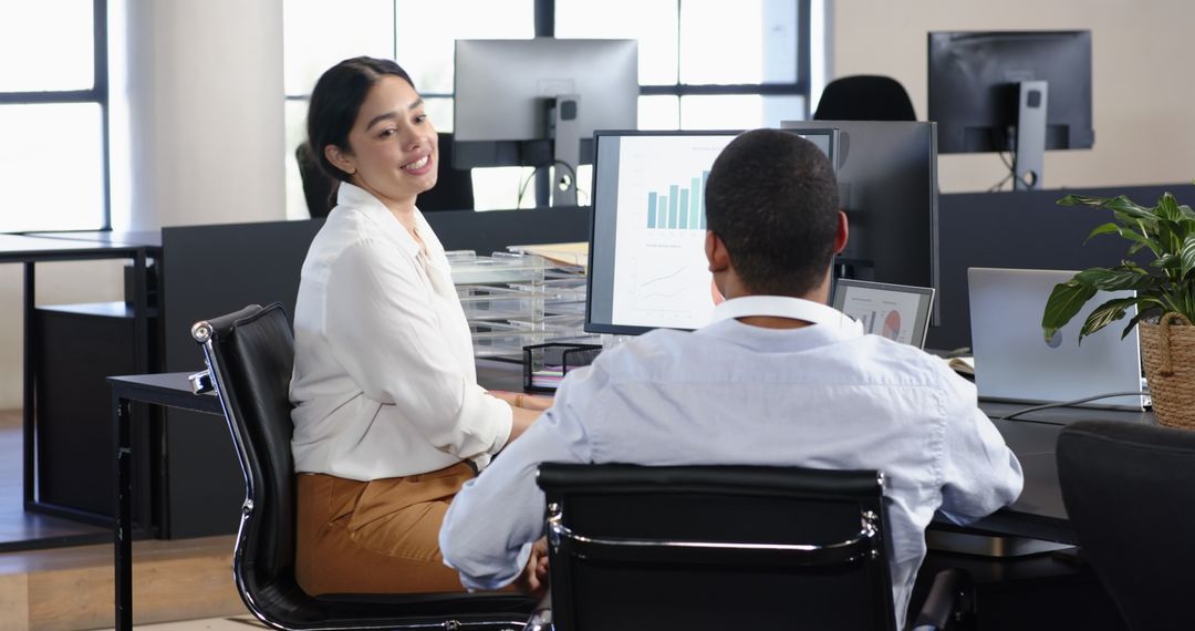 Multiracial Colleagues Collaborating in Modern Office Setting
