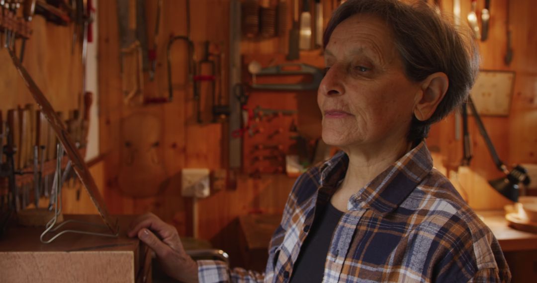 Senior Woman in Woodworking Workshop Pondering - Free Images, Stock Photos and Pictures on Pikwizard.com