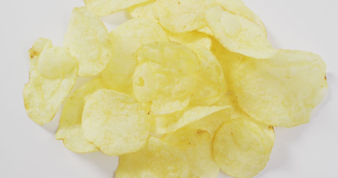 Close up of potato chips with copy space on white surface - Free Images, Stock Photos and Pictures on Pikwizard.com