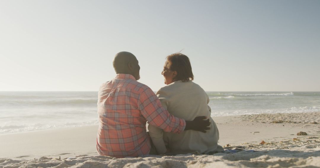 Senior Couple Embracing on Beach Enjoying Sunny Day - Free Images, Stock Photos and Pictures on Pikwizard.com