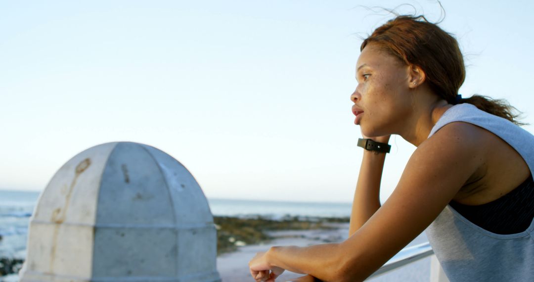 Young Woman Resting After Workout at Seaside - Free Images, Stock Photos and Pictures on Pikwizard.com