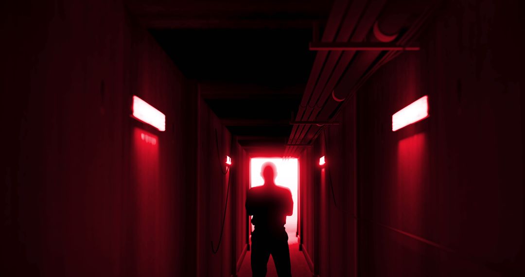 Silhouette of Man in Eerie Red-Lit Corridor