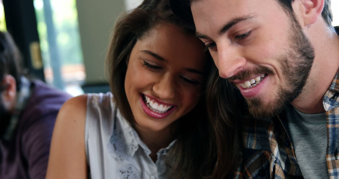 Happy Young Couple Sharing Joyful Moment with Close Bond