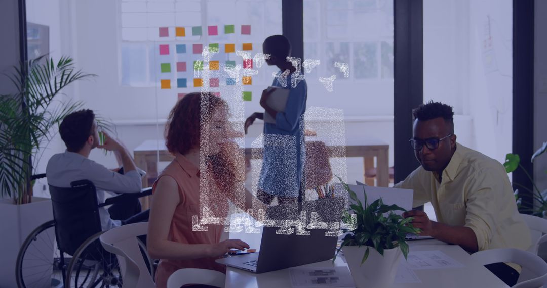 Diverse Team Collaborating in Modern Office with Technology Overlay