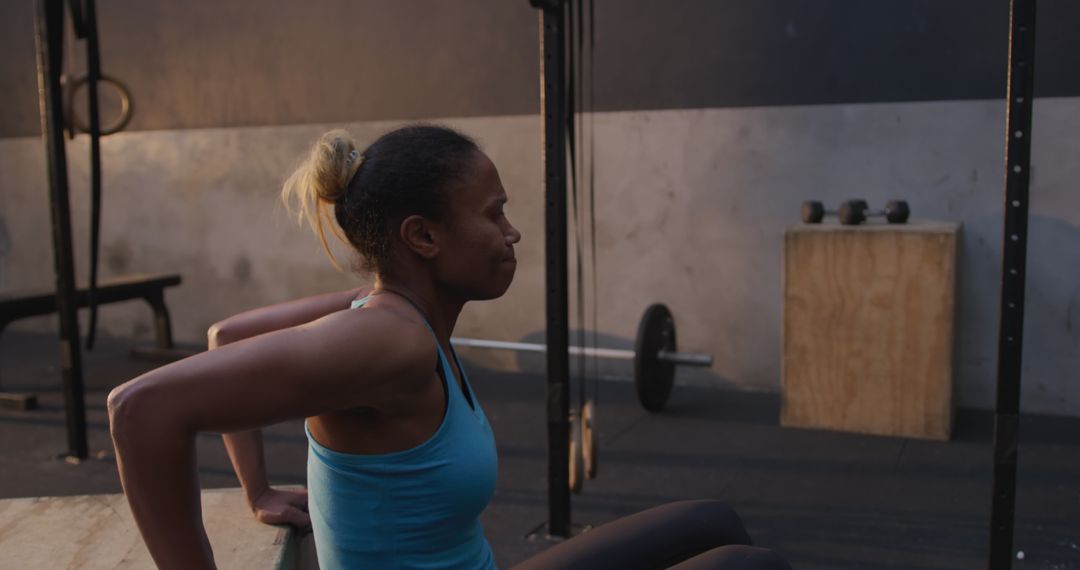 Dedicated Athlete Practicing Tricep Dips Indoors