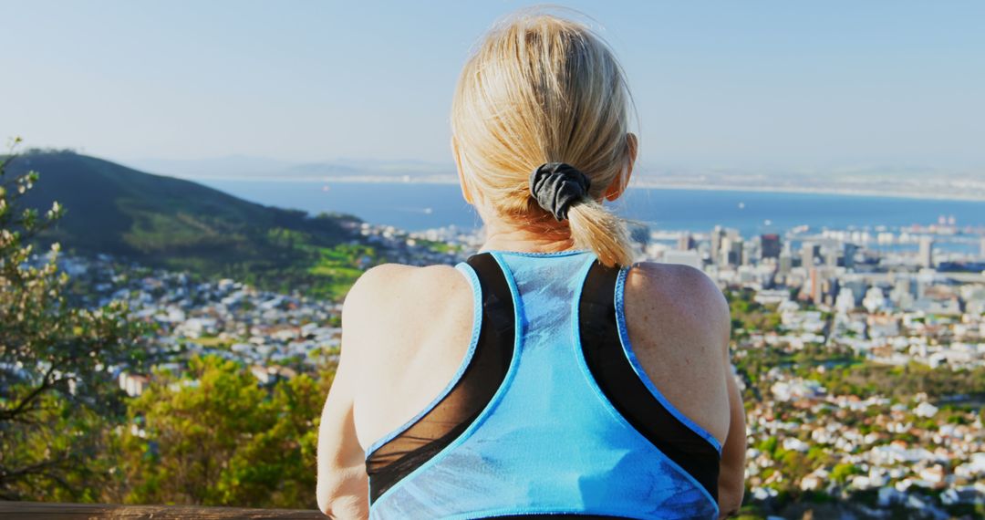 Woman Hiking in Nature Overlooking City Skyline - Free Images, Stock Photos and Pictures on Pikwizard.com