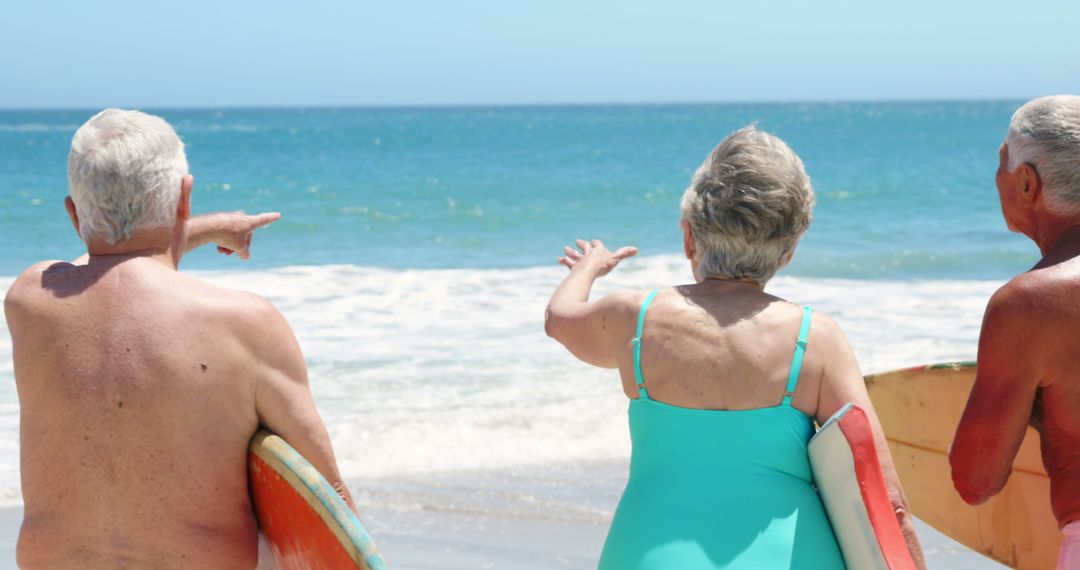 Senior Surfers Enjoying Beach and Ocean - Free Images, Stock Photos and Pictures on Pikwizard.com