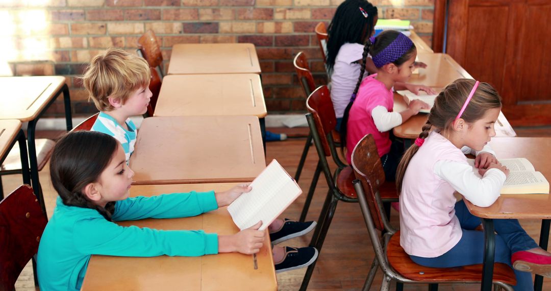 Group of children reading books in classroom - Free Images, Stock Photos and Pictures on Pikwizard.com