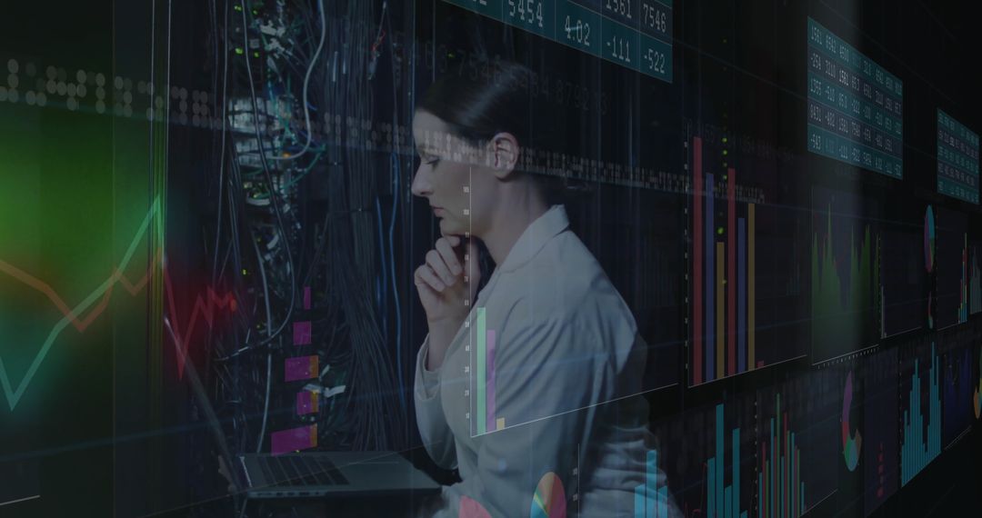 Business Analyst Reviews Financial Data in High-Tech Data Center