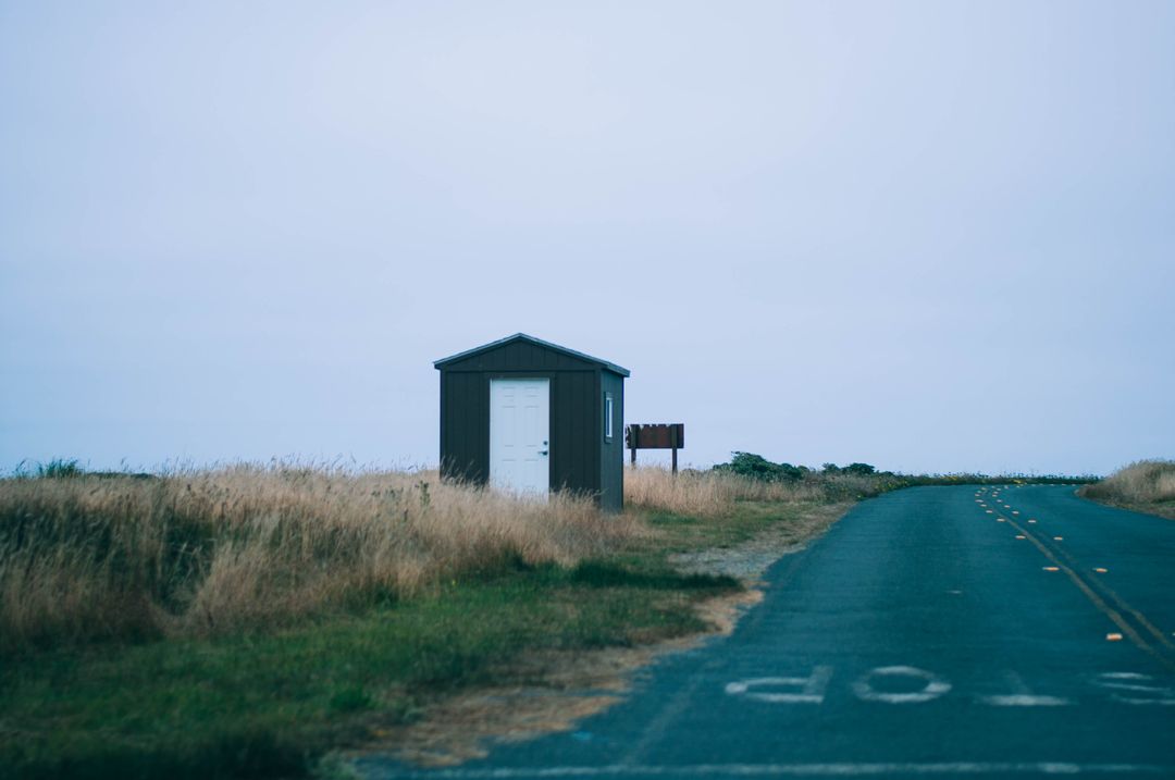 Lonely Shed Along Country Road in Rural Landscape - Free Images, Stock Photos and Pictures on Pikwizard.com