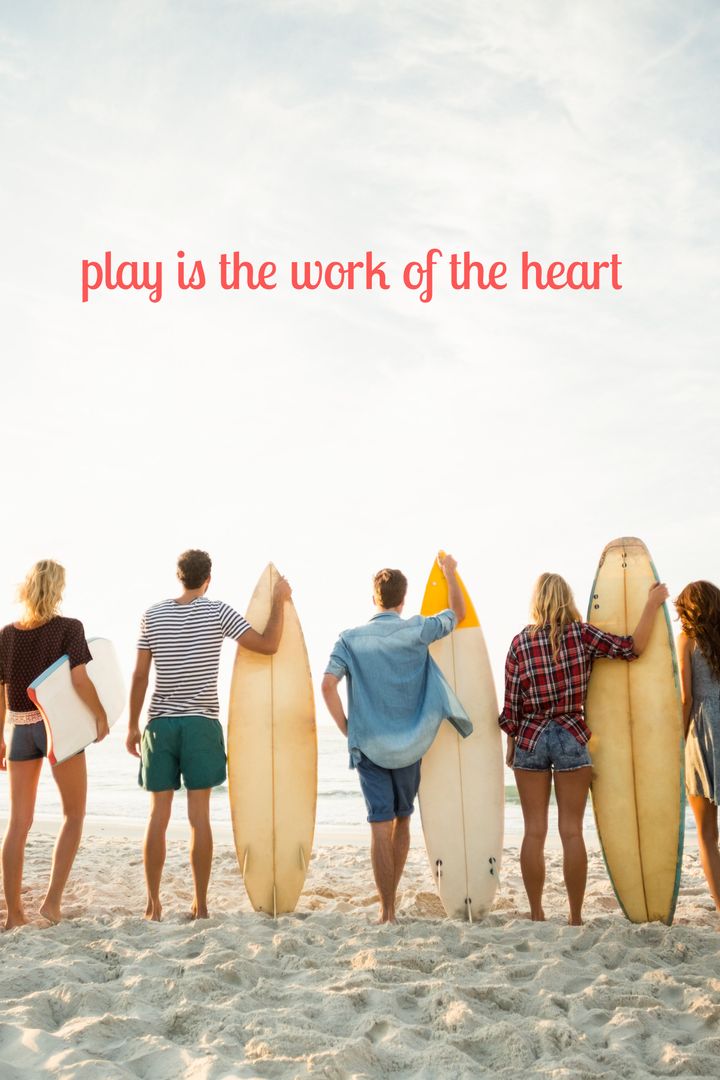 Friends with Surfboards Enjoying Beach Adventure at Sunset