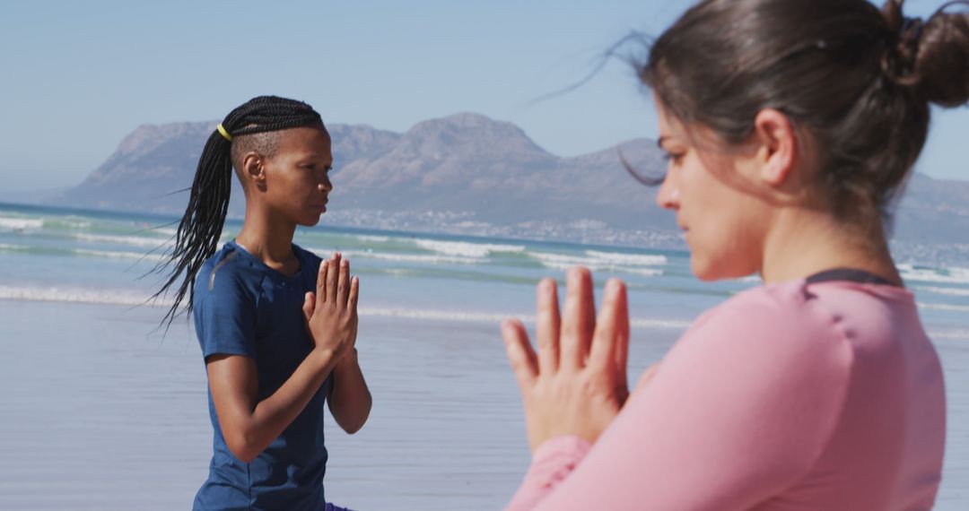 Peaceful Meditation on Beach with Mountain View - Free Images, Stock Photos and Pictures on Pikwizard.com