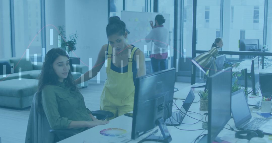 Innovative Team Collaborating on Financial Data in Modern Office