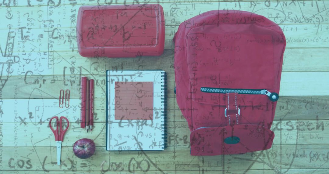 Red Backpack with Supplies and Math Overlay on Wooden Desk