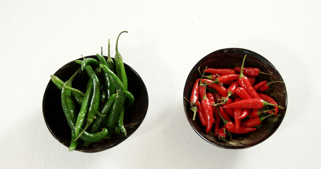 Colorful Green and Red Chili Peppers in Bowls - Free Images, Stock Photos and Pictures on Pikwizard.com