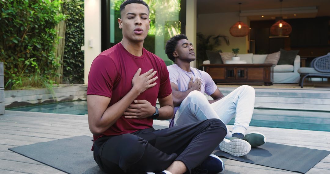 Mindful meditation of friends by poolside for relaxation
