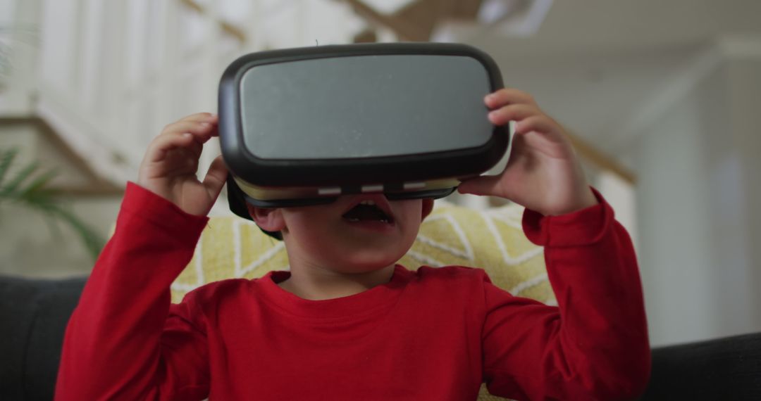 Young Child Experiencing Virtual Reality at Home - Free Images, Stock Photos and Pictures on Pikwizard.com