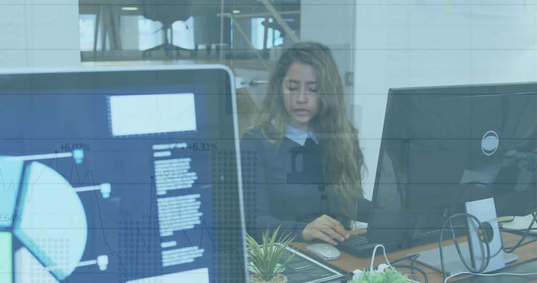 Tech Professional Analyzing Financial Data on Monitors