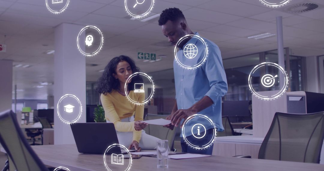 Diverse Professionals Engaging with Digital Business Interfaces at Office