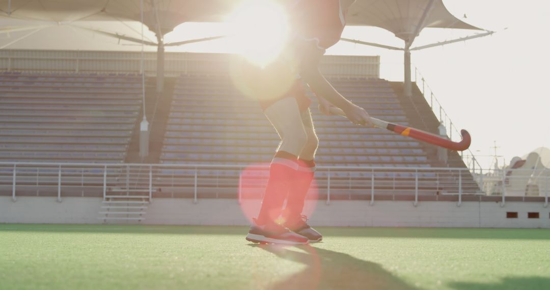 Field Hockey Player Practicing on Sunny Day at Empty Stadium - Free Images, Stock Photos and Pictures on Pikwizard.com