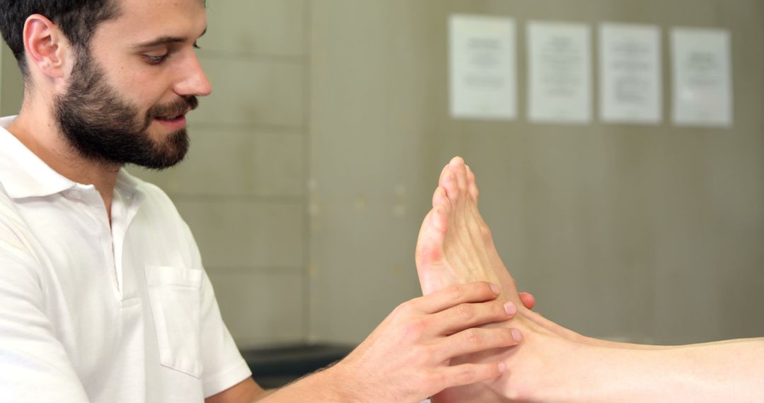 Physiotherapist Conducting Foot Therapy on Client - Free Images, Stock Photos and Pictures on Pikwizard.com