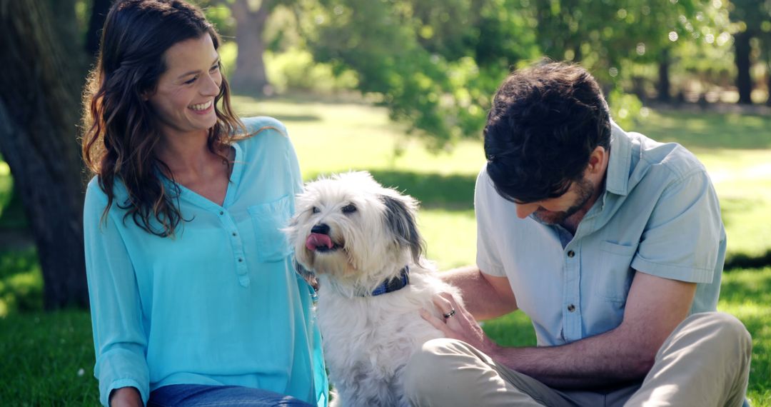 Happy Couple with Pet Dog in Outdoor Park - Free Images, Stock Photos and Pictures on Pikwizard.com