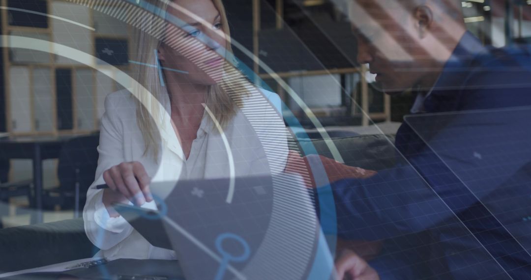 Business Team Reviewing Data with Digital HUD Overlay in Modern Coworking Workspace