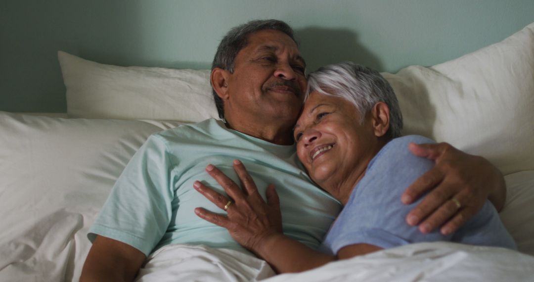 Happy Senior Couple Cuddling in Bed - Free Images, Stock Photos and Pictures on Pikwizard.com