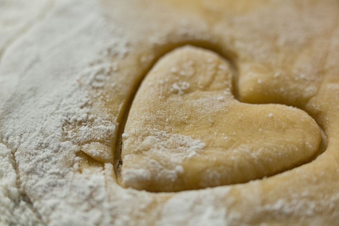 Close up of heart shape on dough - Free Images, Stock Photos and Pictures on Pikwizard.com