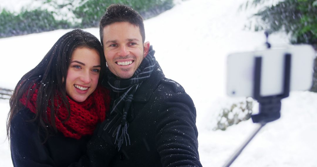 Couple Taking Selfie in Snowy Winter Landscape - Free Images, Stock Photos and Pictures on Pikwizard.com