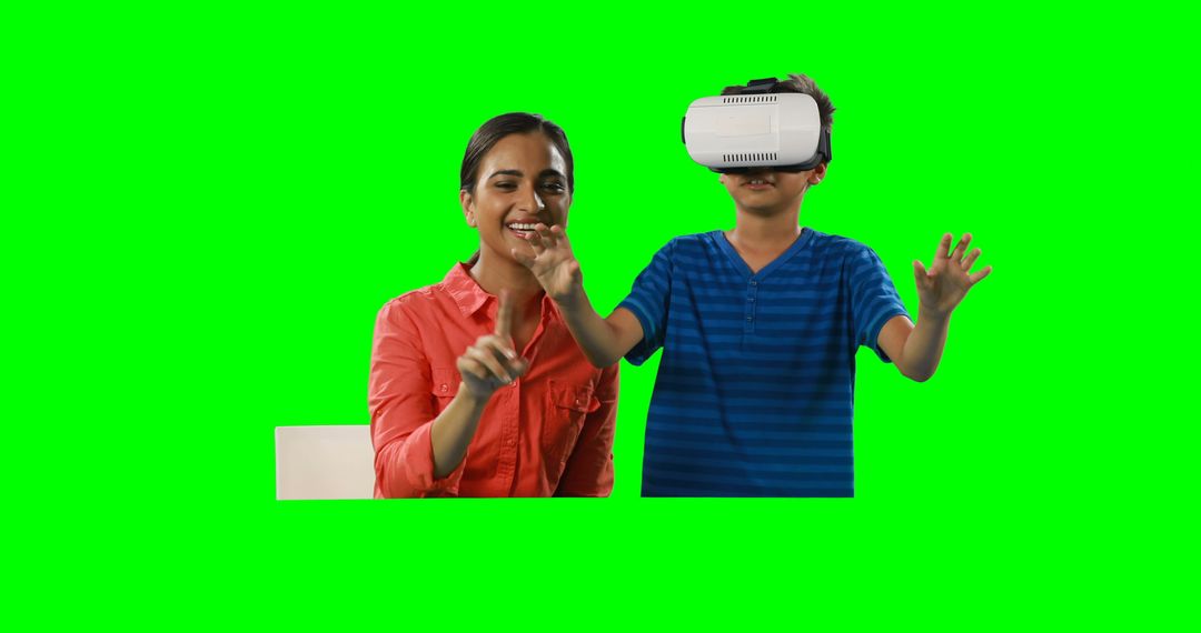 Mother and Son Interacting with Virtual Reality Against Green Screen - Free Images, Stock Photos and Pictures on Pikwizard.com