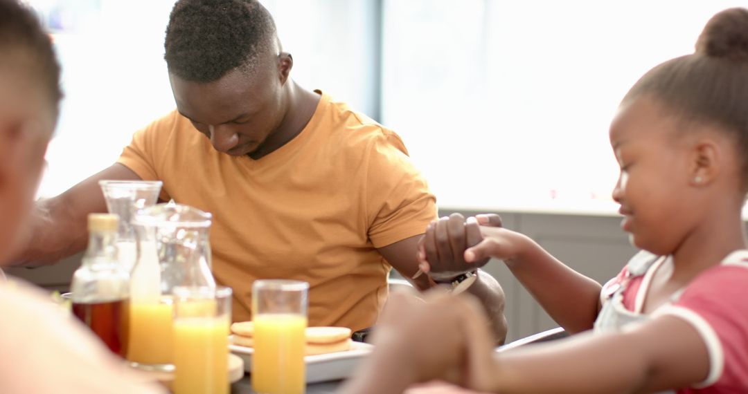 Family Unity During Prayer Before Meal Together at Home
