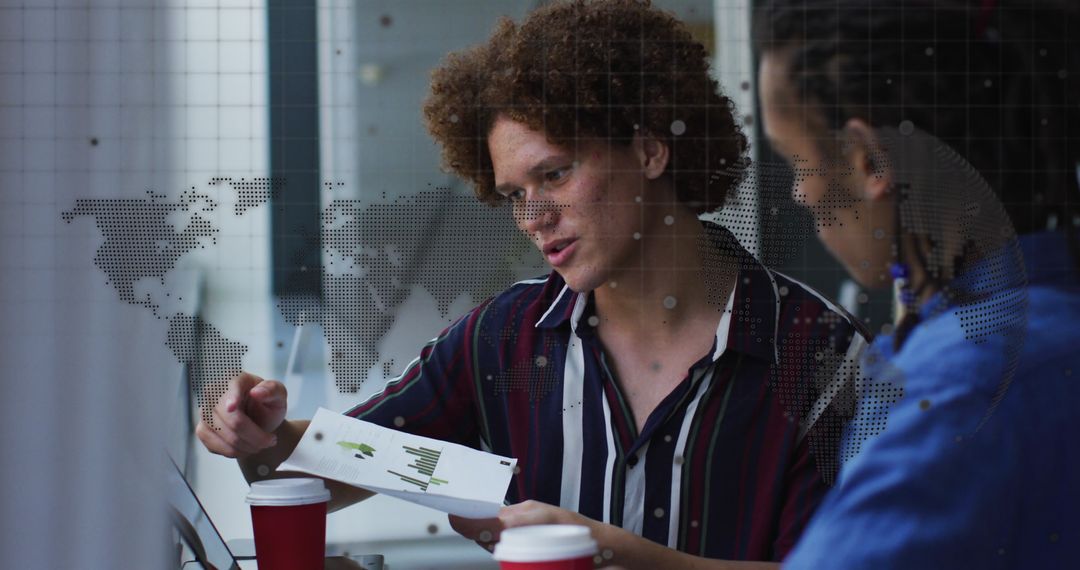 Diverse Business Team Analyzing Data in Office with Global Overlay