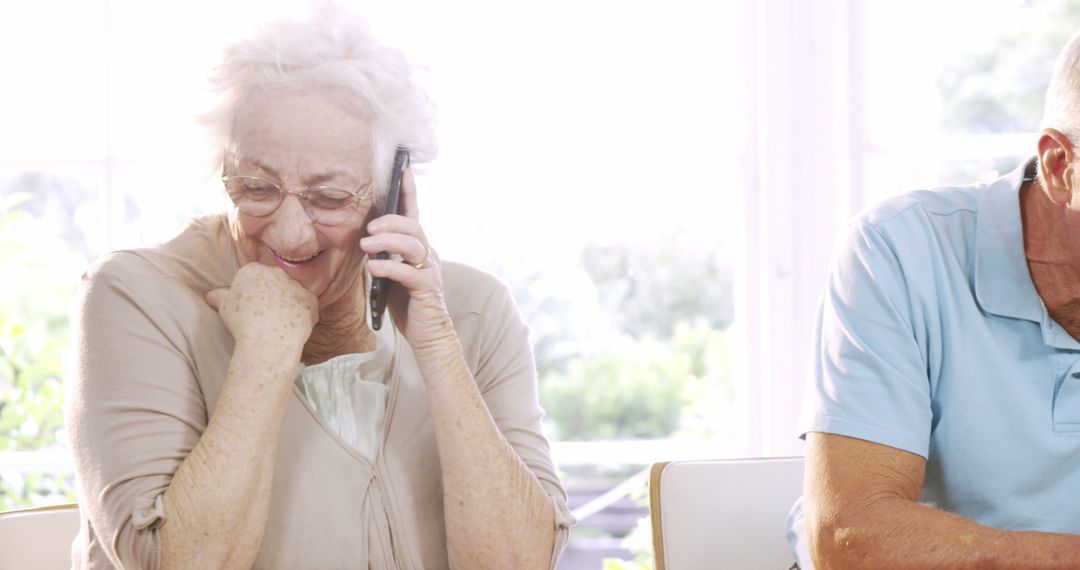 Senior Woman Talking on Phone with Smiling Expressions - Free Images, Stock Photos and Pictures on Pikwizard.com