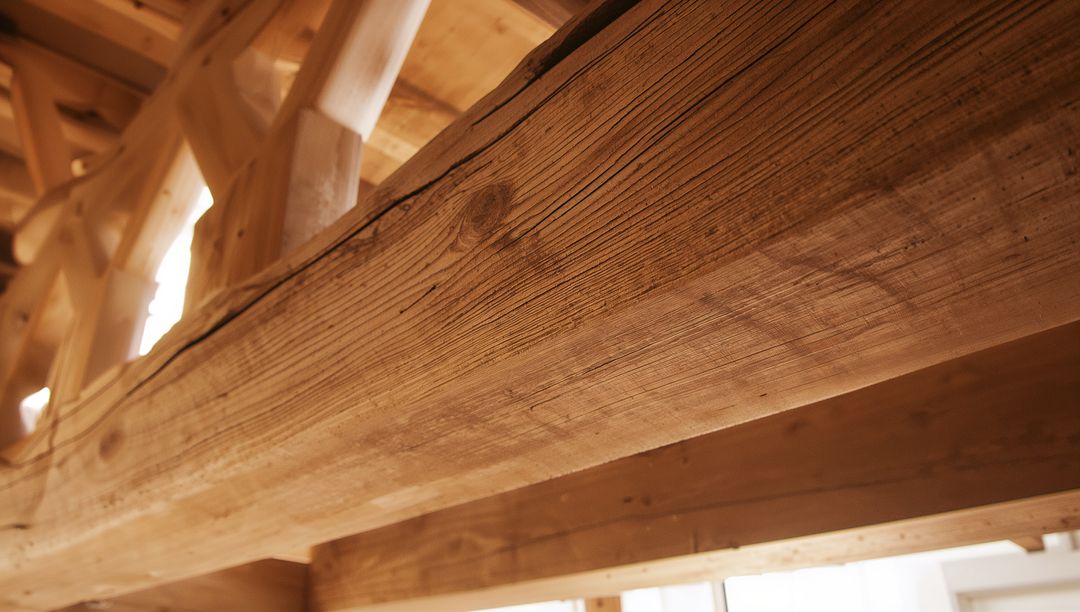 Featuring Rough-Sawn Timber Beam and Exposed Rafters in Rustic Loft Architectural Interior