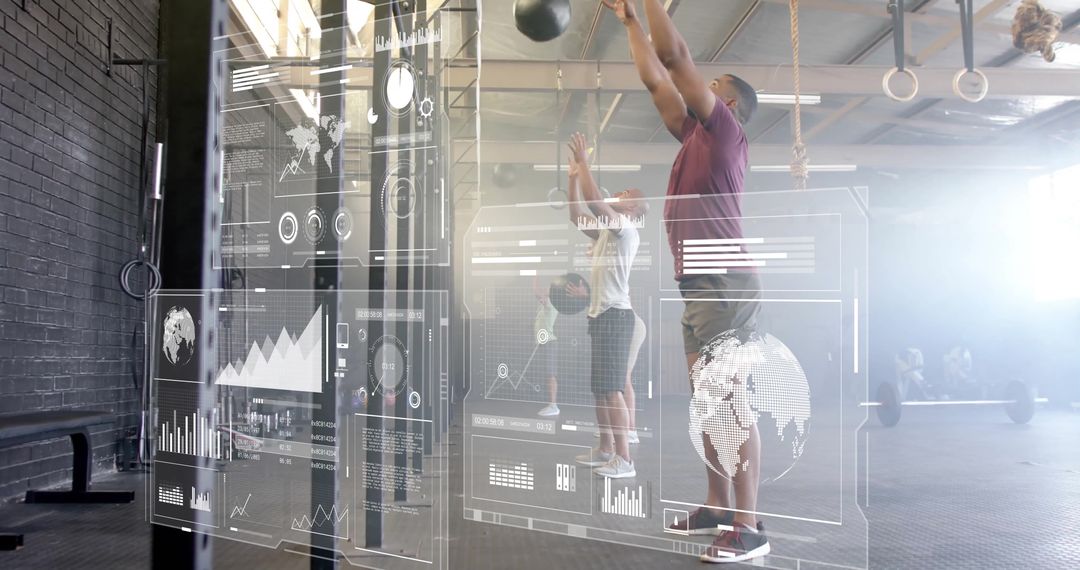 Man Performing Medicine Ball Exercises with Futuristic Display in Gym