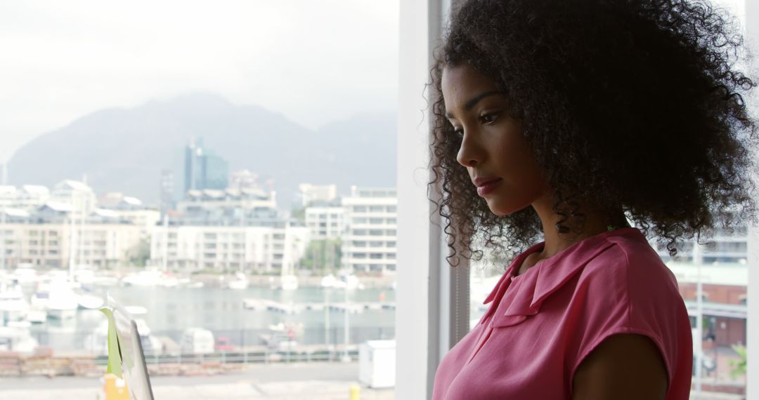 Contemplative Woman in Modern Office with Urban Landscape View - Free Images, Stock Photos and Pictures on Pikwizard.com