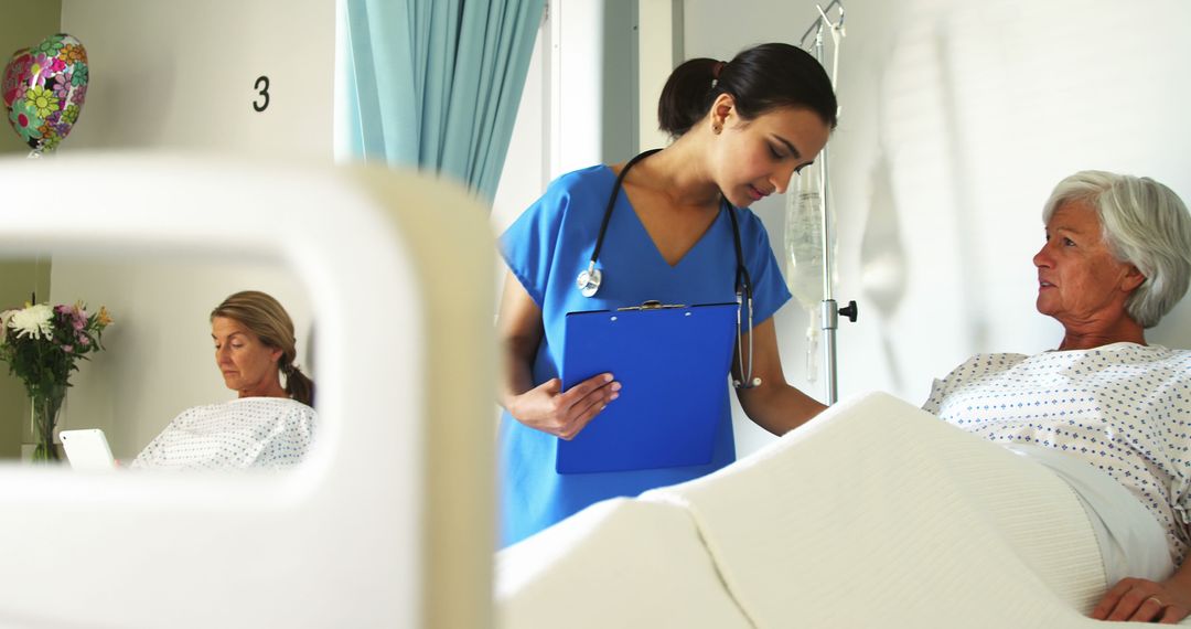 Nurse Assisting Senior Patients in Hospital Room - Free Images, Stock Photos and Pictures on Pikwizard.com