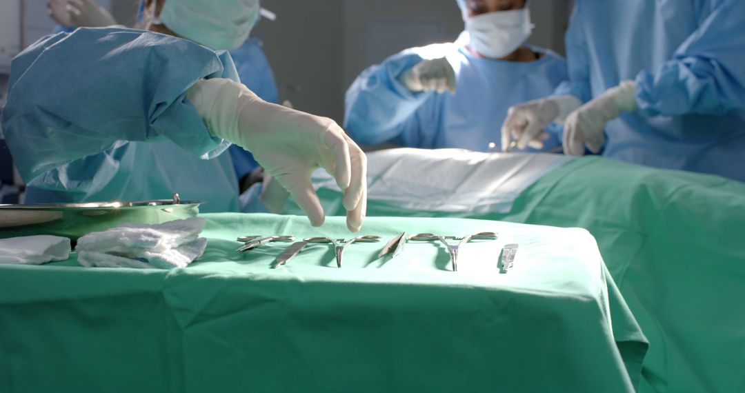 Surgical Team Arranging Instruments in Operating Room - Free Images, Stock Photos and Pictures on Pikwizard.com