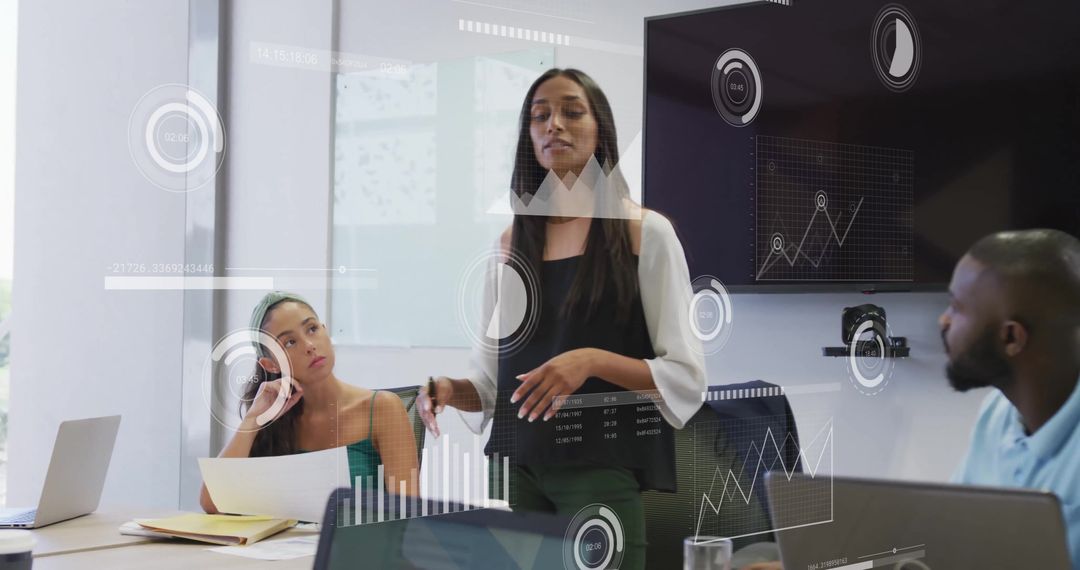 Diverse Team Analyzing Financial Graphics in Modern Office