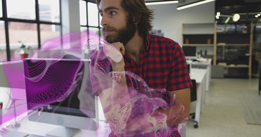 Developer Analyzing Purple Holographic Projection in Modern Office