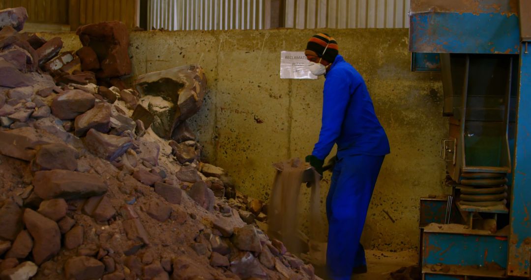 Worker Processing Rocks in Industrial Facility - Free Images, Stock Photos and Pictures on Pikwizard.com